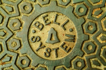 closeup photo shot of Bell manhole cover