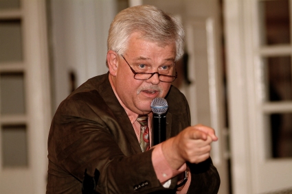 photo of a man with a microphone